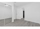 Bright bedroom with mirrored closet doors, doorway and gray floors at 3805 San Angelo Ave, Las Vegas, NV 89102