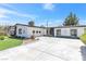 Well-maintained one-story home with a long driveway and desert-friendly landscaping at 3805 San Angelo Ave, Las Vegas, NV 89102
