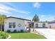 Charming one-story home with manicured lawn, desert landscaping, and unique exterior details at 3805 San Angelo Ave, Las Vegas, NV 89102