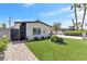 Attractive single-story home featuring a well-kept lawn, desert landscaping, and modern design at 3805 San Angelo Ave, Las Vegas, NV 89102