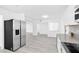 Bright kitchen with stainless steel refrigerator and an open layout, perfect for modern living at 3805 San Angelo Ave, Las Vegas, NV 89102