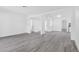 Open living room with modern floors, neutral paint, and lots of natural light at 3805 San Angelo Ave, Las Vegas, NV 89102