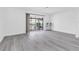 Bright living room featuring sliding glass doors, modern flooring, and fresh, neutral paint at 3805 San Angelo Ave, Las Vegas, NV 89102