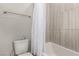 Bright bathroom featuring a shower with tile surround and a decorative shower curtain at 39 Castleton Tower Ct, Henderson, NV 89011