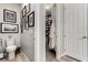 Bathroom featuring a toilet and walk-in closet with many shoes and storage shelves at 39 Castleton Tower Ct, Henderson, NV 89011