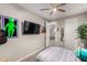 Bedroom with decorative art, hanging guitars, and an open doorway at 39 Castleton Tower Ct, Henderson, NV 89011