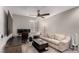 Bedroom features a ceiling fan, desk, love seat, and a large window at 39 Castleton Tower Ct, Henderson, NV 89011