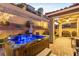 Backyard with a covered patio and hot tub featuring landscape and mountain views at 39 Castleton Tower Ct, Henderson, NV 89011