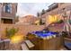 Outdoor hot tub with built-in lighting and seating set against a hillside backdrop at 39 Castleton Tower Ct, Henderson, NV 89011