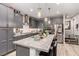 Stylish kitchen features stainless appliances, granite countertops, and pendant lighting at 39 Castleton Tower Ct, Henderson, NV 89011