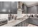Modern kitchen featuring granite countertops and stainless steel appliances at 39 Castleton Tower Ct, Henderson, NV 89011