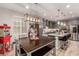 Open concept kitchen and dining area with stainless steel appliances and granite countertops at 39 Castleton Tower Ct, Henderson, NV 89011
