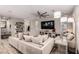 Inviting living room features a comfortable sofa, a large flat screen tv, recessed lighting, and windows at 39 Castleton Tower Ct, Henderson, NV 89011