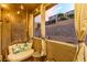 Cozy patio with comfortable seating, decorative lighting, and desert views at 39 Castleton Tower Ct, Henderson, NV 89011