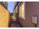 Exterior of a home with a walkway that includes a gate and window at 39 Castleton Tower Ct, Henderson, NV 89011