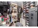 Walk-in closet featuring clothing, shoes, storage shelves, an ottoman, and a ProVault safe at 39 Castleton Tower Ct, Henderson, NV 89011