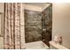 Bathroom with tiled shower, shower curtain and fixtures at 3912 Palos Verdes St, Las Vegas, NV 89119