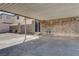 Carport featuring brick wall with door, desert landscaping and concrete surface at 3912 Palos Verdes St, Las Vegas, NV 89119