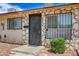 Close up view of a townhome front entrance and security gate on the front door at 3912 Palos Verdes St, Las Vegas, NV 89119
