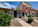 Attractive townhome with stone accents, a red tile roof, and mature landscaping at 3912 Palos Verdes St, Las Vegas, NV 89119