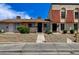 Charming townhome featuring unique stonework, a red tile roof, and well-maintained landscaping at 3912 Palos Verdes St, Las Vegas, NV 89119