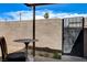 Outdoor patio featuring brick wall, gated entrance, and table with chair at 3912 Palos Verdes St, Las Vegas, NV 89119