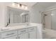 A full bathroom with a tub, shower, vanity and mirror with closet and tile flooring at 3930 University Center Dr # 208, Las Vegas, NV 89119