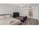 The bedroom features hardwood floors, a ceiling fan, and two beds, complemented by an ensuite bathroom and closet at 3930 University Center Dr # 208, Las Vegas, NV 89119