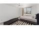 Bright bedroom featuring a ceiling fan, window with blinds, and two beds, creating a peaceful and inviting atmosphere at 3930 University Center Dr # 208, Las Vegas, NV 89119