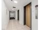Elevator lobby featuring clean tile floors, two elevators and a fire exit at 3930 University Center Dr # 208, Las Vegas, NV 89119