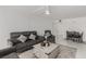 Bright living room with tile floors, neutral walls, comfortable seating and ceiling fan at 3930 University Center Dr # 208, Las Vegas, NV 89119