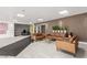 Spacious lobby with modern seating, plants, light tile flooring, wood slat walls, elevators and recessed lighting at 3930 University Center Dr # 208, Las Vegas, NV 89119