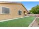 Well-kept backyard with artificial turf offers a perfect outdoor space at 4078 Blue Manor Ln, North Las Vegas, NV 89032