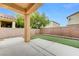 A covered patio and tidy artificial turf offer a relaxing outdoor space at 4078 Blue Manor Ln, North Las Vegas, NV 89032