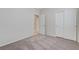 Bright bedroom featuring neutral tones, carpeted floors, and a closet at 4078 Blue Manor Ln, North Las Vegas, NV 89032