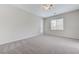 Spacious bedroom featuring neutral walls, carpet flooring, a ceiling fan, and abundant natural light at 4078 Blue Manor Ln, North Las Vegas, NV 89032