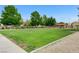 Expansive green community lawn surrounded by trees, landscaping, and neighborhood homes at 4078 Blue Manor Ln, North Las Vegas, NV 89032