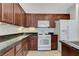 Kitchen featuring dark wood cabinets and modern appliances at 4078 Blue Manor Ln, North Las Vegas, NV 89032