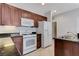 Kitchen featuring white appliances and ample countertop space at 4078 Blue Manor Ln, North Las Vegas, NV 89032