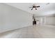 Spacious living room with tiled flooring and ceiling fan at 4078 Blue Manor Ln, North Las Vegas, NV 89032