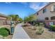 A sidewalk through the community, green areas, and trees that enhance the appeal of this lovely place at 4078 Blue Manor Ln, North Las Vegas, NV 89032