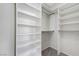 Custom walk-in closet featuring built-in shelving and ample storage space at 4078 Blue Manor Ln, North Las Vegas, NV 89032