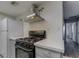 A kitchen featuring modern countertops, stainless steel appliances, and ample natural light at 413 N Lamb Blvd # F, Las Vegas, NV 89110