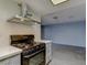 A modern kitchen features stainless steel appliances, light countertops and access to an open living area at 413 N Lamb Blvd # F, Las Vegas, NV 89110