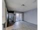 Living area boasting modern wood floors, gray walls, and easy access to the adjacent kitchen area at 413 N Lamb Blvd # F, Las Vegas, NV 89110