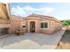 Back patio with fountain and tiled roof at 4329 Skimmers Ct, North Las Vegas, NV 89084
