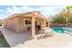 Inviting backyard featuring a covered patio, built-in BBQ, and a sparkling private pool at 4329 Skimmers Ct, North Las Vegas, NV 89084
