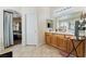 Bathroom featuring a double vanity and direct access to a bedroom at 4329 Skimmers Ct, North Las Vegas, NV 89084