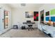 Bedroom featuring carpet, a desk, door to the backyard, sound dampening panels, and an instrument at 4329 Skimmers Ct, North Las Vegas, NV 89084