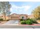 Charming single-story home with a well-manicured lawn and inviting curb appeal at 4329 Skimmers Ct, North Las Vegas, NV 89084